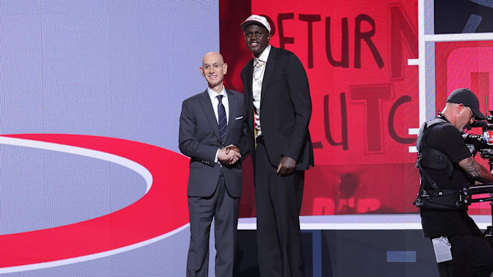 Jun 25, 2025; Brooklyn, NY;  Khaman Maluach stands with NBA commissioner Adam Silver during the first round of the 2025 NBA Draft