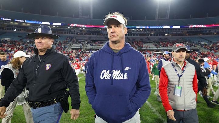 Jan 2, 2025; Jacksonville, FL, USA; Mississippi Rebels head coach Lane Kiffin celebrates after beating the Duke Blue Devils in the Gator Bowl at EverBank Stadium. Mandatory Credit: Nathan Ray Seebeck-Imagn Images