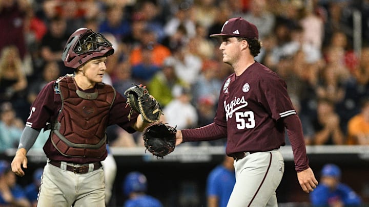 Jun 19, 2024; Omaha, NE, USA; Texas A&M Aggies pitcher Evan Aschenbeck (53) greets Texas A&M Aggies catcher Jackson Appel (20) after the eighth inning at Charles Schwab Field Omaha. Mandatory Credit: Steven Branscombe-Imagn Images Jun 19, 2024; Omaha, NE, USA; Texas A&M Aggies pitcher Evan Aschenbeck (53) greets Texas A&M Aggies catcher Jackson Appel (20) after the eighth inning at Charles Schwab Field Omaha. Mandatory Credit: Steven Branscombe-Imagn Images