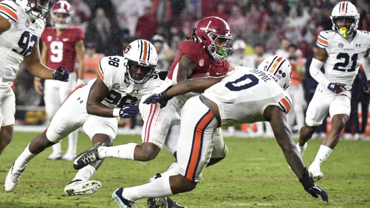 Nov 26, 2022; Tuscaloosa, Alabama, USA; Alabama Crimson Tide  running back Jahmyr Gibbs (1) runs the ball for a touchdown against Auburn Tigers defensive end Marcuss Bragg (98) and Auburn Tigers linebacker Owen Pappoe (0) at Bryant-Denny Stadium. Alabama won 49-27. Mandatory Credit: Gary Cosby Jr.-USA TODAY Sports