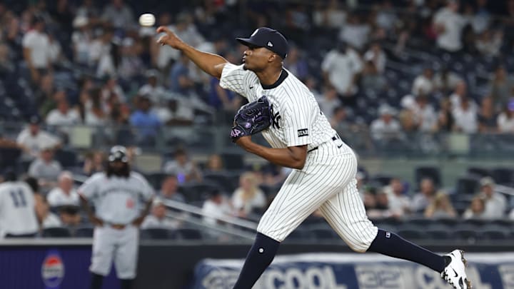 Aug 12, 2025; Bronx, New York, USA; New York Yankees relief pitcher Yerry De los Santos (73) delivers a pitch during the ninth inning against the Minnesota Twins at Yankee Stadium. Mandatory Credit: Vincent Carchietta-Imagn Images