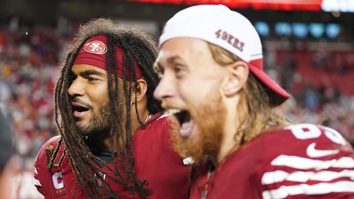 Warner and Kittle celebrate after a win. 
