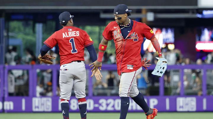 Jun 21, 2025; Miami, Florida, USA;  Atlanta Braves second baseman Ozzie Albies (1) and right fielder Ronald Acuna Jr. (13) celebrate after defeating the Miami Marlins following the game at loanDepot Park. Mandatory Credit: Rhona Wise-Imagn Images