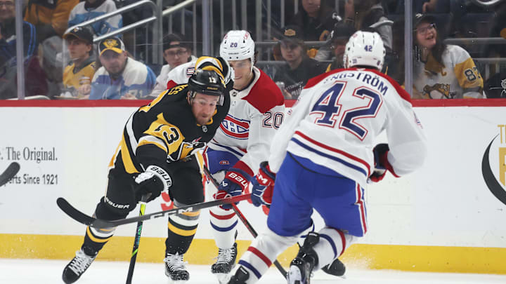 Dec 21, 2025; Pittsburgh, Pennsylvania, USA;  Pittsburgh Penguins right wing Kevin Hayes (13) moves the puck against Montréal Canadiens left wing Juraj Slafkovsk? (20) and defenseman Adam Engstrom (42) during the first period at PPG Paints Arena. Mandatory Credit: Charles LeClaire-Imagn Images
