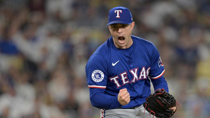 Jun 13, 2024; Los Angeles, California, USA;  Texas Rangers relief pitcher David Robertson (37) reacts after striking out Los Angeles Dodgers shortstop Mookie Betts (50), designated hitter Shohei Ohtani (17) and first baseman Freddie Freeman (5) in the eighth inning at Dodger Stadium. Mandatory Credit: Jayne Kamin-Oncea-USA TODAY Sports