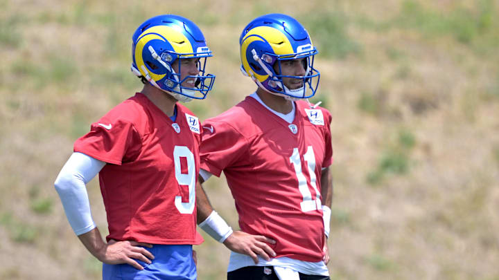 May 28, 2024; Thousand Oaks, CA, USA; Los Angeles Rams quarterbacks Matthew Stafford (9) and Jimmy Garoppolo (11) look on during OTAs at the team training facility at California Lutheran University. Mandatory Credit: Jayne Kamin-Oncea-Imagn Images May 28, 2024; Thousand Oaks, CA, USA; Los Angeles Rams quarterbacks Matthew Stafford (9) and Jimmy Garoppolo (11) look on during OTAs at the team training facility at California Lutheran University. Mandatory Credit: Jayne Kamin-Oncea-Imagn Images