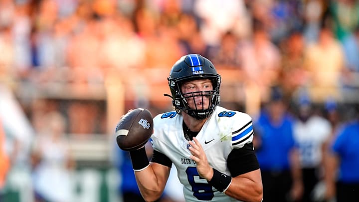 Deer Creek's Grady Adamson looks to throw a pass during the high school football game between Bishop McGuinness and Deer Creek High School at Bishop McGuinness High School in Oklahoma City., Friday, Aug., 30, 2024. Deer Creek's Grady Adamson looks to throw a pass during the high school football game between Bishop McGuinness and Deer Creek High School at Bishop McGuinness High School in Oklahoma City., Friday, Aug., 30, 2024.