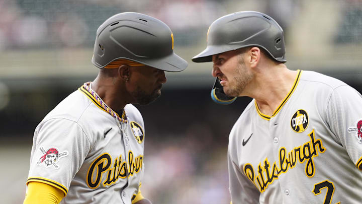 Aug 1, 2025; Denver, Colorado, USA; Pittsburgh Pirates designated hitter Andrew McCutchen (22) celebrates his three run home run with first baseman Spencer Horwitz (2) in the first inning against the Colorado Rockies at Coors Field. Mandatory Credit: Ron Chenoy-Imagn Images