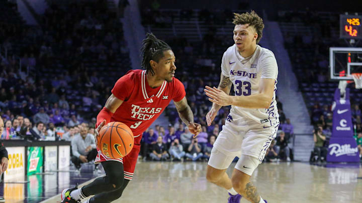 Jan 14, 2025; Manhattan, Kansas, USA; Texas Tech Red Raiders guard Elijah Hawkins (3) is guarded by Kansas State Wildcats forward Coleman Hawkins (33) during the second half at Bramlage Coliseum. Mandatory Credit: Scott Sewell-Imagn Images