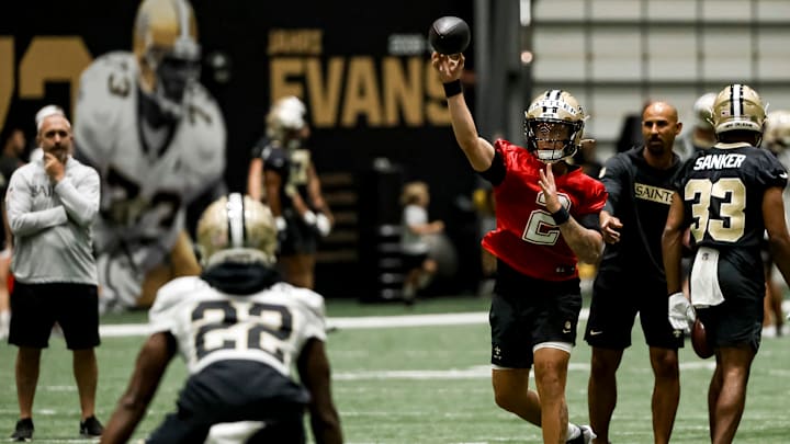 Quarterback Spencer Rattler (2) makes a throw during New Orleans Saints OTAs