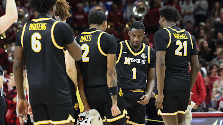 Feb 22, 2025; Fayetteville, Arkansas, USA; Missouri Tigers guard Marques Warrick (1) celebrates with teammates after making a three-point shot at the end of the first quarter against the Arkansas Razorbacks at Bud Walton Arena. Mandatory Credit: Nelson Chenault-Imagn Images