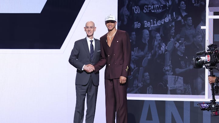 Jun 25, 2025; Brooklyn, NY, USA;  Carter Bryant stands with NBA commissioner Adam Silver after being selected as the 14th pick by the San Antonio Spurs in the first round of the 2025 NBA Draft at Barclays Center. Mandatory Credit: Brad Penner-Imagn Images