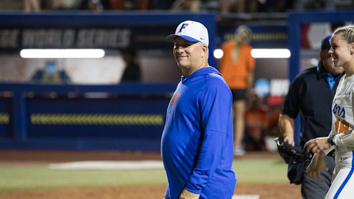 May 30, 2024; Oklahoma City, OK, USA;  Florida Gators head coach Tim Walton smiles towards his team coming off the field in the fourth inning against the Oklahoma St. Cowgirls during a Women's College World Series softball game at Devon Park. Mandatory Credit: Brett Rojo-Imagn Images