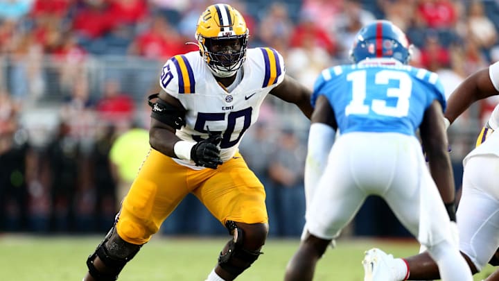 Sep 30, 2023; Oxford, Mississippi, USA; LSU Tigers offensive linemen Emery Jones Jr. (50) blocks during the first half against the Mississippi Rebels at Vaught-Hemingway Stadium. Mandatory Credit: Petre Thomas-Imagn Images