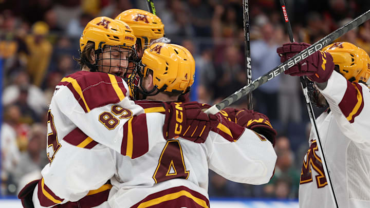 Apr 6, 2023; Tampa, Florida, USA; Minnesota defenseman Mike Koster (4) is congratulated by forward Matthew Knies (89) after scoring a goal against Boston University in the first period in the semifinals of the 2023 Frozen Four college ice hockey tournament at Amalie Arena. Mandatory Credit: Nathan Ray Seebeck-Imagn Images Apr 6, 2023; Tampa, Florida, USA; Minnesota defenseman Mike Koster (4) is congratulated by forward Matthew Knies (89) after scoring a goal against Boston University in the first period in the semifinals of the 2023 Frozen Four college ice hockey tournament at Amalie Arena. Mandatory Credit: Nathan Ray Seebeck-Imagn Images
