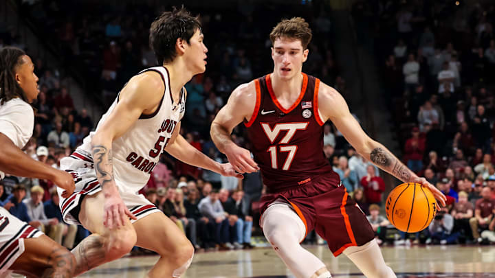 Dec 2, 2025; Columbia, South Carolina, USA; Virginia Tech Hokies guard Neoklis Avdalas (17) drives around South Carolina Gamecocks guard Mike Sharavjamts (55) in the second half at Colonial Life Arena. Mandatory Credit: Jeff Blake-Imagn Images Dec 2, 2025; Columbia, South Carolina, USA; Virginia Tech Hokies guard Neoklis Avdalas (17) drives around South Carolina Gamecocks guard Mike Sharavjamts (55) in the second half at Colonial Life Arena. Mandatory Credit: Jeff Blake-Imagn Images