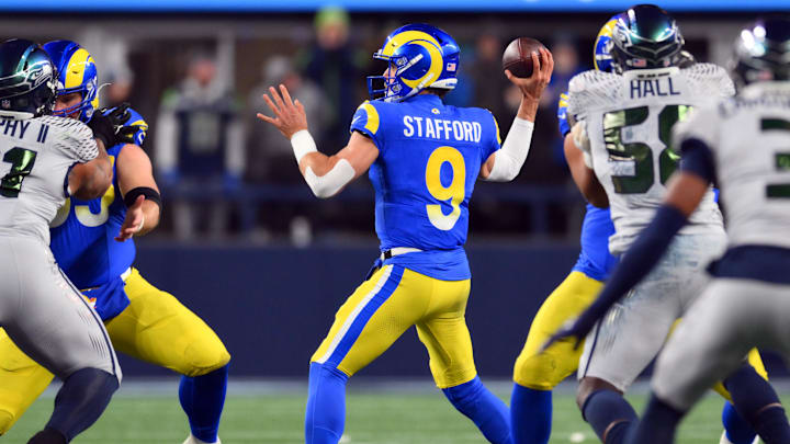 Dec 18, 2025; Seattle, Washington, USA; Los Angeles Rams quarterback Matthew Stafford (9) throws a pass against the Seattle Seahawks in the first half at Lumen Field. Mandatory Credit: Steven Bisig-Imagn Images