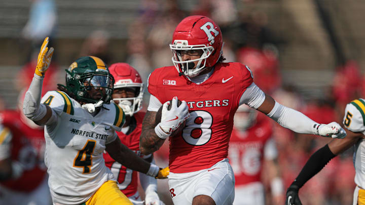 Sep 13, 2025; Piscataway, New Jersey, USA; Rutgers Scarlet Knights wide receiver KJ Duff (8) fights for yards as Norfolk State Spartans defensive back Kahleef Jimmison (4) pursues during the first half at SHI Stadium. Mandatory Credit: Vincent Carchietta-Imagn Images