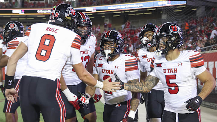 Oct 26, 2024; Houston, Texas, USA; Utah Utes running back Micah Bernard (2) celebrates with teammates after scoring a touchdown during the third quarter against the Houston Cougars at TDECU Stadium. Mandatory Credit: Troy Taormina-Imagn Images