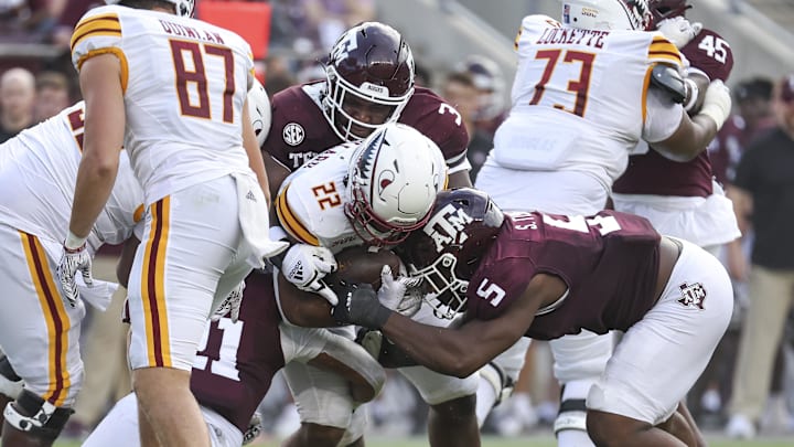 Sep 16, 2023; College Station, Texas, USA; Texas A&M Aggies defensive lineman McKinnley Jackson (3) and defensive lineman Shemar Turner (5) tackle Louisiana Monroe Warhawks running back Isaiah Woullard (22) during the third quarter at Kyle Field. Mandatory Credit: Troy Taormina-USA TODAY Sports