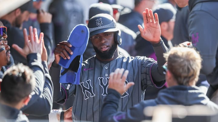 Apr 11, 2026; New York City, New York, USA;  New York Mets center fielder Luis Robert Jr. (88) celebrates in the dugout with his teammates after scoring a run in the first inning against the Athletics at Citi Field. Mandatory Credit: Wendell Cruz-Imagn Images