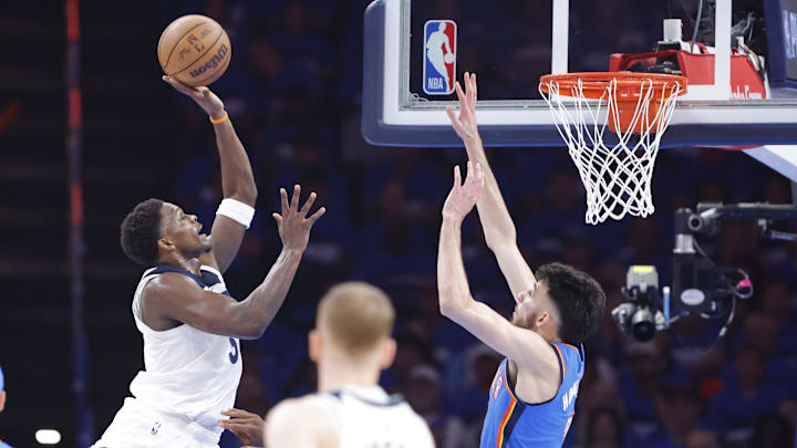 May 22, 2025; Oklahoma City, Oklahoma, USA; Minnesota Timberwolves guard Anthony Edwards (5) shoots against Oklahoma City Thunder forward Chet Holmgren (7) in the first quarter during game two of the western conference finals for the 2025 NBA Playoffs at Paycom Center. Mandatory Credit: Alonzo Adams-Imagn Images May 22, 2025; Oklahoma City, Oklahoma, USA; Minnesota Timberwolves guard Anthony Edwards (5) shoots against Oklahoma City Thunder forward Chet Holmgren (7) in the first quarter during game two of the western conference finals for the 2025 NBA Playoffs at Paycom Center. Mandatory Credit: Alonzo Adams-Imagn Images