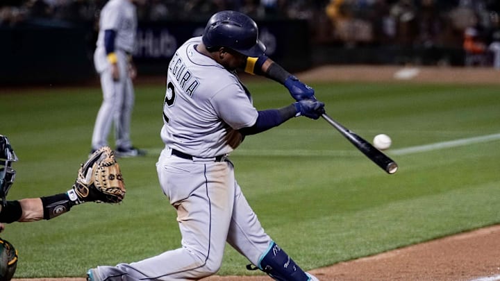 Seattle Mariners shortstop Jean Segura (2) hits a two RBI single against the Oakland Athletics during the fifth inning at the Oakland Coliseum in 2018.