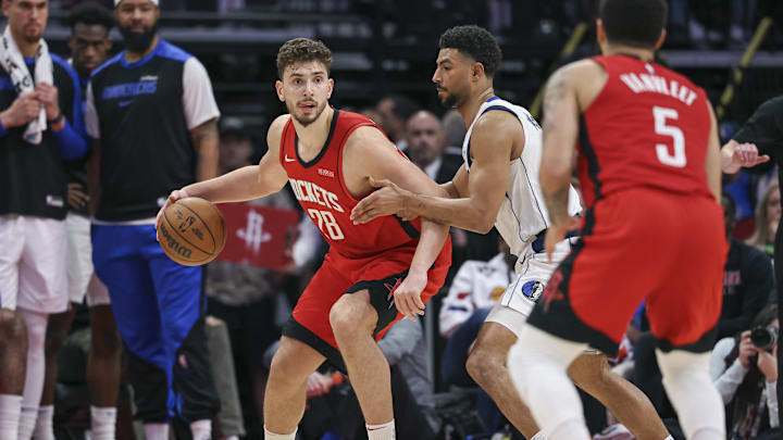 Jan 1, 2025; Houston, Texas, USA; Houston Rockets center Alperen Sengun (28) controls the ball during the fourth quarter against the Dallas Mavericks at Toyota Center. Mandatory Credit: Troy Taormina-Imagn Images
