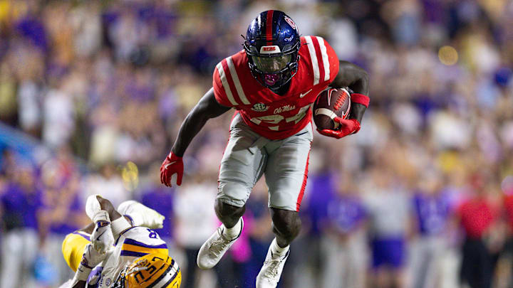 Oct 12, 2024; Baton Rouge, Louisiana, USA; Mississippi Rebels running back Ulysses Bentley IV (24) is tackled by LSU Tigers safety Major Burns (8) during the second half at Tiger Stadium. Mandatory Credit: Stephen Lew-Imagn Images Oct 12, 2024; Baton Rouge, Louisiana, USA; Mississippi Rebels running back Ulysses Bentley IV (24) is tackled by LSU Tigers safety Major Burns (8) during the second half at Tiger Stadium. Mandatory Credit: Stephen Lew-Imagn Images
