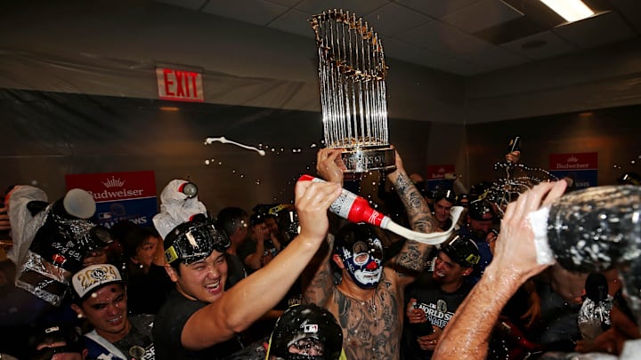 Oct 31, 2024; New York, New York, USA; Los Angeles Dodgers two-way player Shohei Ohtani (17) celebrates in the locker room after the Los Angeles Dodgers beat the New York Yankees in game four to win the 2024 MLB World Series at Yankee Stadium.