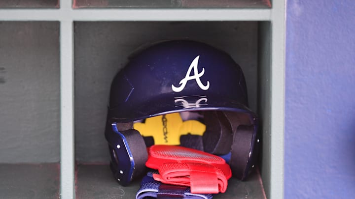 Atlanta Braves batting helmet inside the dugout before game against the Philadelphia Phillies at Citizens Bank Park on March 31.