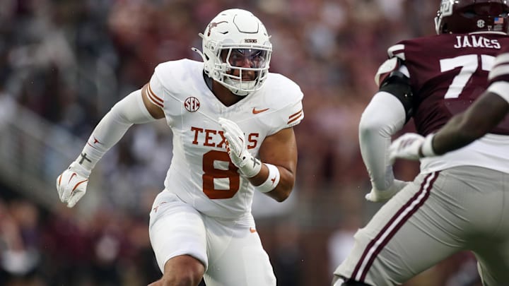 Texas Longhorns linebacker Trey Moore attempts to get into the backfield during the second quarter against the Mississippi State Bulldogs at Davis Wade Stadium at Scott Field. Texas Longhorns linebacker Trey Moore attempts to get into the backfield during the second quarter against the Mississippi State Bulldogs at Davis Wade Stadium at Scott Field.