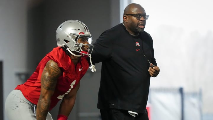 Mar 7, 2024; Columbus, OH, USA; Ohio State Buckeyes running backs coach Tony Alford works with Quinshon Judkins (1) during spring football practice at the Woody Hayes Athletic Center.
