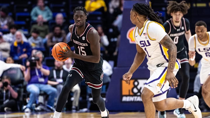 Feb 18, 2025; Baton Rouge, Louisiana, USA;  South Carolina Gamecocks guard Morris Ugusuk (15) dribbles against LSU Tigers guard Jordan Sears (1) during the second half at Pete Maravich Assembly Center. Mandatory Credit: Stephen Lew-Imagn Images