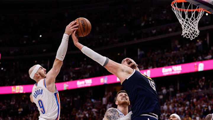May 11, 2025; Denver, Colorado, USA; Oklahoma City Thunder guard Alex Caruso (9) and Denver Nuggets center Nikola Jokic (15) battle for a rebound as center Isaiah Hartenstein (55) defends in the fourth quarter during game four of the second round of the 2025 NBA Playoffs at Ball Arena. Mandatory Credit: Isaiah J. Downing-Imagn Images May 11, 2025; Denver, Colorado, USA; Oklahoma City Thunder guard Alex Caruso (9) and Denver Nuggets center Nikola Jokic (15) battle for a rebound as center Isaiah Hartenstein (55) defends in the fourth quarter during game four of the second round of the 2025 NBA Playoffs at Ball Arena. Mandatory Credit: Isaiah J. Downing-Imagn Images