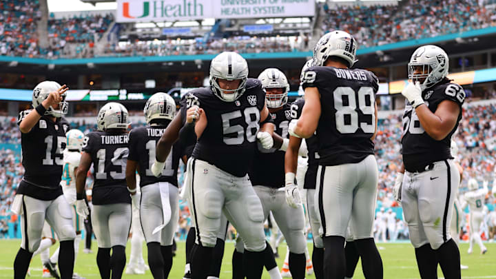 Nov 17, 2024; Miami Gardens, Florida, USA; Las Vegas Raiders tight end Brock Bowers (89) celebrates with guard Jackson Powers-Johnson (58) after scoring a touchdown against the Miami Dolphins during the third quarter at Hard Rock Stadium. Mandatory Credit: Sam Navarro-Imagn Images