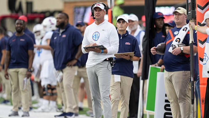Sep 14, 2024; Winston-Salem, North Carolina, USA;  Mississippi Rebels head coach Lane Kiffin looks at the board during the first half against the Wake Forest Demon Deacons at Allegacy Federal Credit Union Stadium. Mandatory Credit: Jim Dedmon-Imagn Images