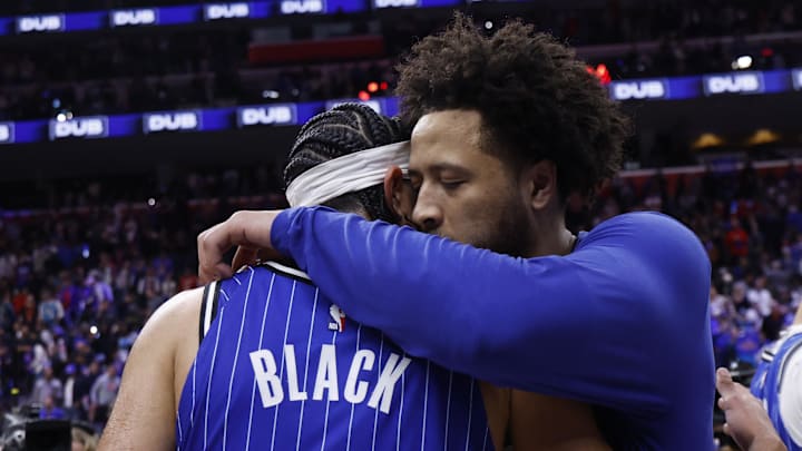 May 3, 2026; Detroit, Michigan, USA; Detroit Pistons guard Cade Cunningham (2) hugs Orlando Magic guard Anthony Black (0): Rick Osentoski-Imagn Images