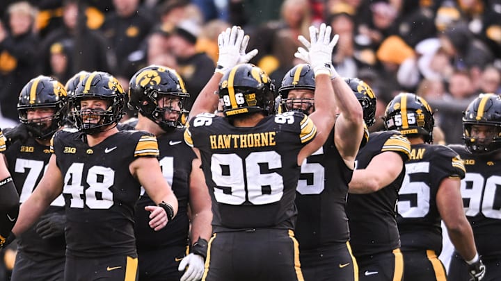 Oct 25, 2025; Iowa City, Iowa, USA; Iowa Hawkeyes defensive lineman Aaron Graves (95) reacts with teammates during the fourth quarter against the Minnesota Golden Gophers at Kinnick Stadium. Mandatory Credit: Jeffrey Becker-Imagn Images