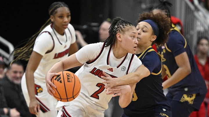 Mar 1, 2026; Louisville, Kentucky, USA;  Louisville Cardinals guard Imari Berry (2) dribbles against Notre Dame Fighting Irish guard Hannah Hidalgo (3) during the second half at KFC Yum! Center. Notre Dame defeated Louisville 65-62. Mandatory Credit: Jamie Rhodes-Imagn Images