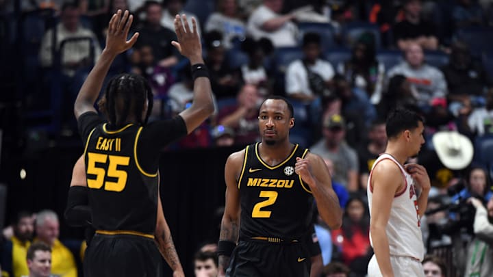 Mar 13, 2024; Nashville, TN, USA; Missouri Tigers guard Tamar Bates (2) celebrates with guard Sean East II (55) after a basket against the Georgia Bulldogs at Bridgestone Arena. Mandatory Credit: Christopher Hanewinckel-Imagn Images Mar 13, 2024; Nashville, TN, USA; Missouri Tigers guard Tamar Bates (2) celebrates with guard Sean East II (55) after a basket against the Georgia Bulldogs at Bridgestone Arena. Mandatory Credit: Christopher Hanewinckel-Imagn Images