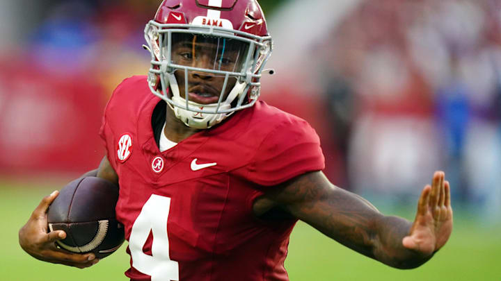 Sep 2, 2023; Tuscaloosa, Alabama, USA; Alabama Crimson Tide quarterback Jalen Milroe (4) carries the ball against the Middle Tennessee Blue Raiders for a touchdown during the first quarter at Bryant-Denny Stadium. Mandatory Credit: John David Mercer-Imagn Images