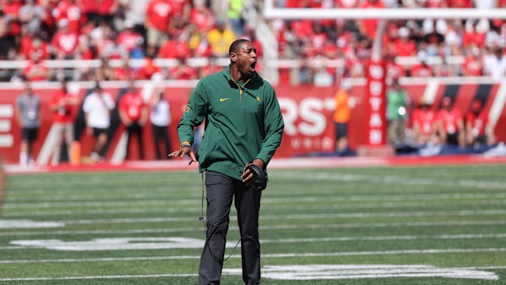 Sep 7, 2024; Salt Lake City, Utah, USA; Baylor Bears assistant coach Dallas Baker reacts to a play against the Utah Utes during the second quarter at Rice-Eccles Stadium. Mandatory Credit: Rob Gray-Imagn Images Sep 7, 2024; Salt Lake City, Utah, USA; Baylor Bears assistant coach Dallas Baker reacts to a play against the Utah Utes during the second quarter at Rice-Eccles Stadium. Mandatory Credit: Rob Gray-Imagn Images