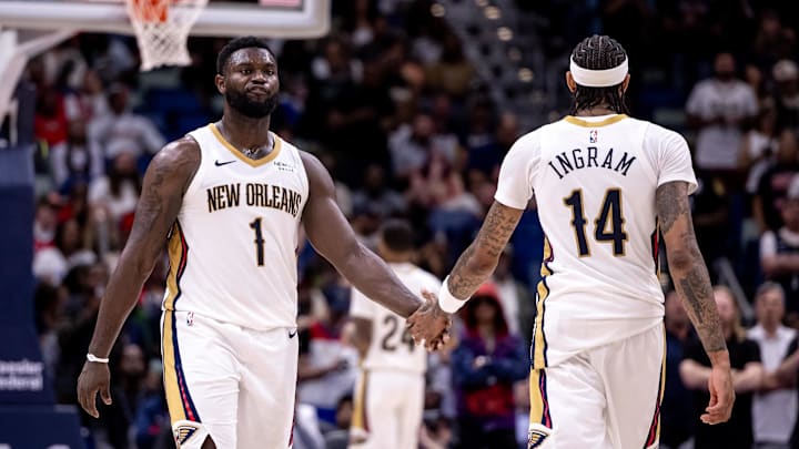 Nov 1, 2024; New Orleans, Louisiana, USA;  New Orleans Pelicans forward Brandon Ingram (14) slaps hands with forward Zion Williamson (1) after a play against the Indiana Pacers during the second half at Smoothie King Center. Mandatory Credit: Stephen Lew-Imagn Images