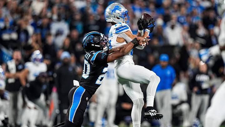 Detroit Lions wide receiver Amon-Ra St. Brown (14) makes a catch against Carolina Panthers safety Zakee Wheatley (20) during the first half at Bank of America Stadium in Charlotte on Sunday, Oct. 4, 2026.