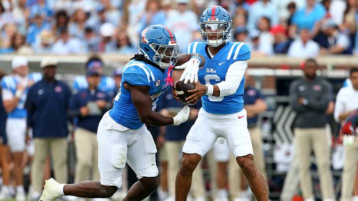 Oct 31, 2026; Oxford, Mississippi, USA;  Mississippi Rebels quarterback Trinidad Chambliss (6) hands the ball off to running back Shekai Mills-Knight (33) during the second quarter against the Auburn Tigers at Vaught-Hemingway Stadium.  Mandatory Credit: Petre Thomas-Imagn Images