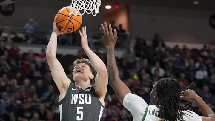 March 9, 2025; Las Vegas, NV, USA; Washington State Cougars guard Tomas Thrastarson (5) shoots the basketball against San Francisco Dons center Carlton Linguard Jr. (2) during the first half in the quarterfinal of the West Coast Conference tournament at Orleans Arena. Mandatory Credit: Kyle Terada-Imagn Images
