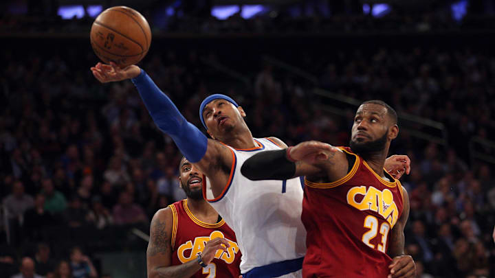 Dec 7, 2016; New York, NY, USA; Cleveland Cavaliers small forward LeBron James (23) and New York Knicks small forward Carmelo Anthony (7) fight for a rebound during the third quarter at Madison Square Garden. Mandatory Credit: Brad Penner-Imagn Images