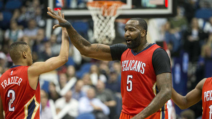 Apr 13, 2016; Minneapolis, MN, USA; New Orleans Pelicans center Kendrick Perkins (5) high fives New Orleans Pelicans guard Tim Frazier (2) after making a buzzer beater shot at the end of third quarter against the Minnesota Timberwolves at Target Center. The Timberwolves won 144-109. Mandatory Credit: Jesse Johnson-Imagn Images