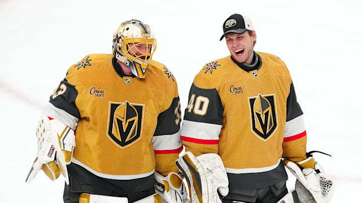 Apr 20, 2025; Las Vegas, Nevada, USA; Vegas Golden Knights goaltender Adin Hill (33) celebrates with goaltender Akira Schmid (40) after they defeated the Minnesota Wild 4-2 in game one of the first round of the 2025 Stanley Cup Playoffs at T-Mobile Arena. Mandatory Credit: Stephen R. Sylvanie-Imagn Images